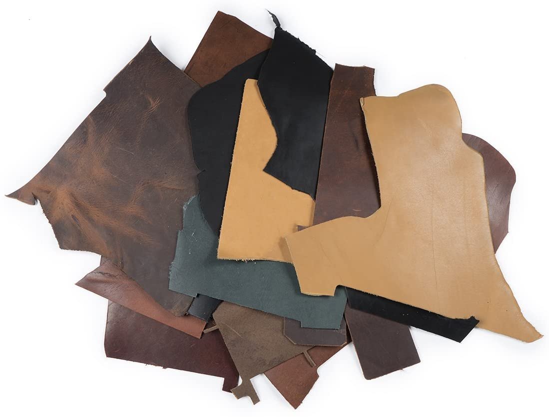 2 lb box of leather remnants. Box contains an assortment of colors. Color options are Dark Drown, Saddle, Black, Buckskin, Stone and Charcoal (and a few other earth tone colors) Main image