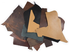 2 lb box of leather remnants. Box contains an assortment of colors. Color options are Dark Drown, Saddle, Black, Buckskin, Stone and Charcoal (and a few other earth tone colors)